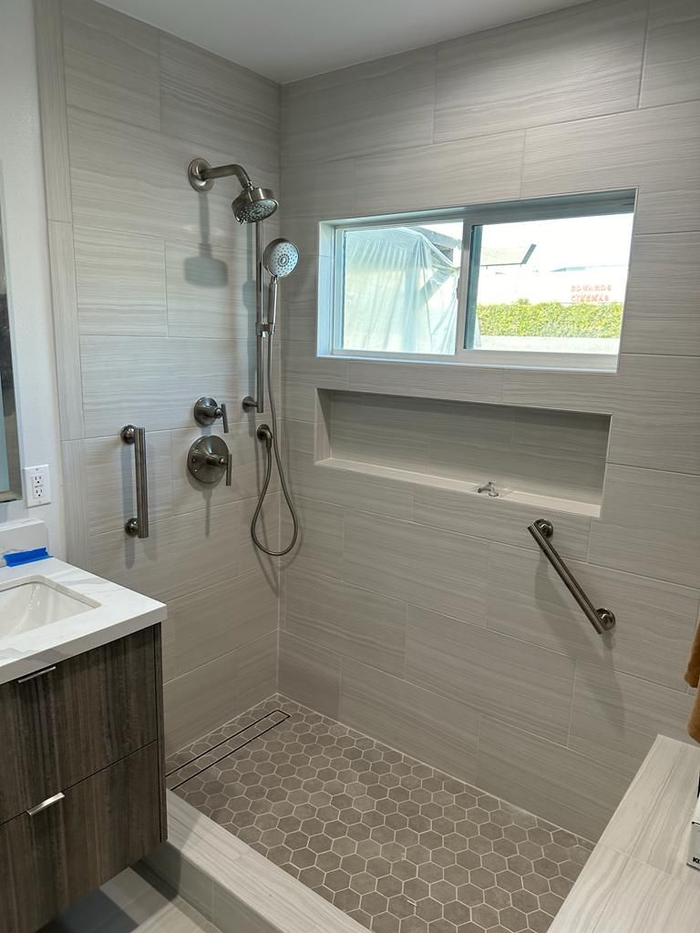 Tiled walk-in shower with a linear drain, finished by SoCal Plumbing Co.